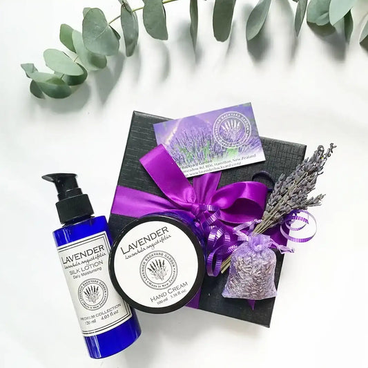 Gift set featuring Lavender Hand Cream, Lavender Silk Lotion, a dried lavender sachet, mini lavender dry flower, and a Lavender Field bookmark, all infused with calming lavender essential oil for a relaxing and aromatic experience.