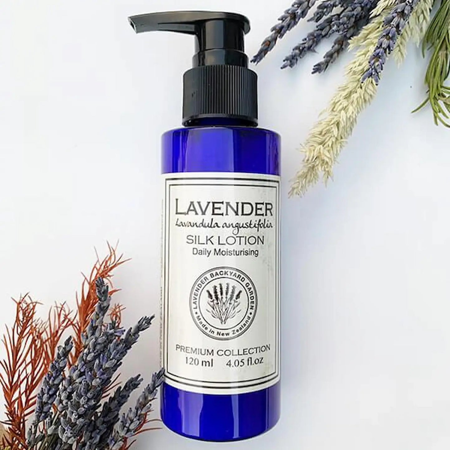 Apricot Oil & Olive Oil Lavender Silk Lotion with dried lavender flower bouquet as background.