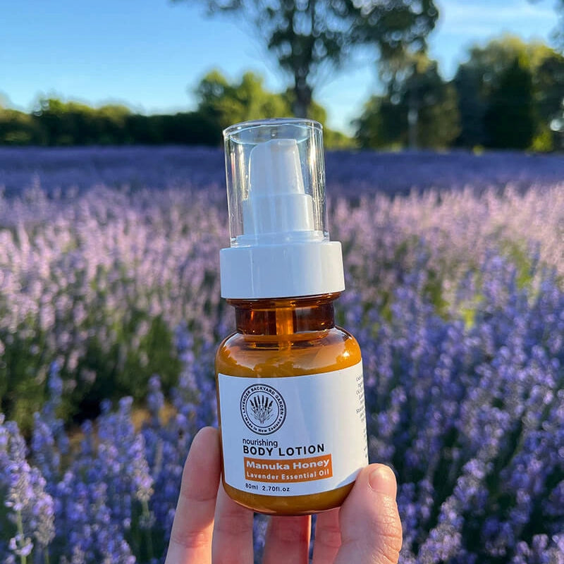 Lavender Manuka Honey Lotions moisturisers with a lavender field at sunset in the background, highlighting sources from our lavender farm.