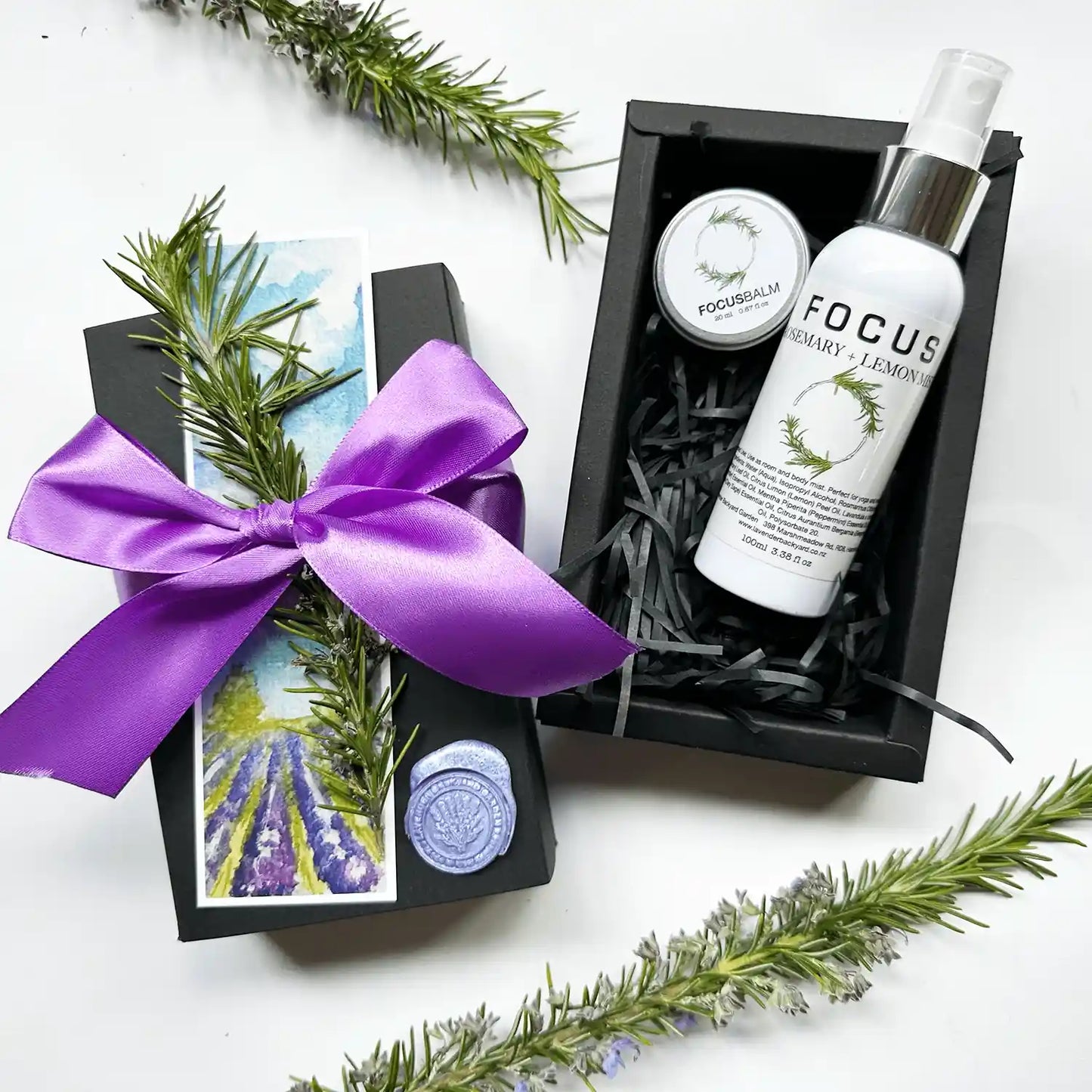 Calm Mood Rosemary Birthday Giftset with focus balm and focus mist, scented by rosemary essential oil, packaged in a purple ribbon gift box with rosemary dried herbs and a bookmark.