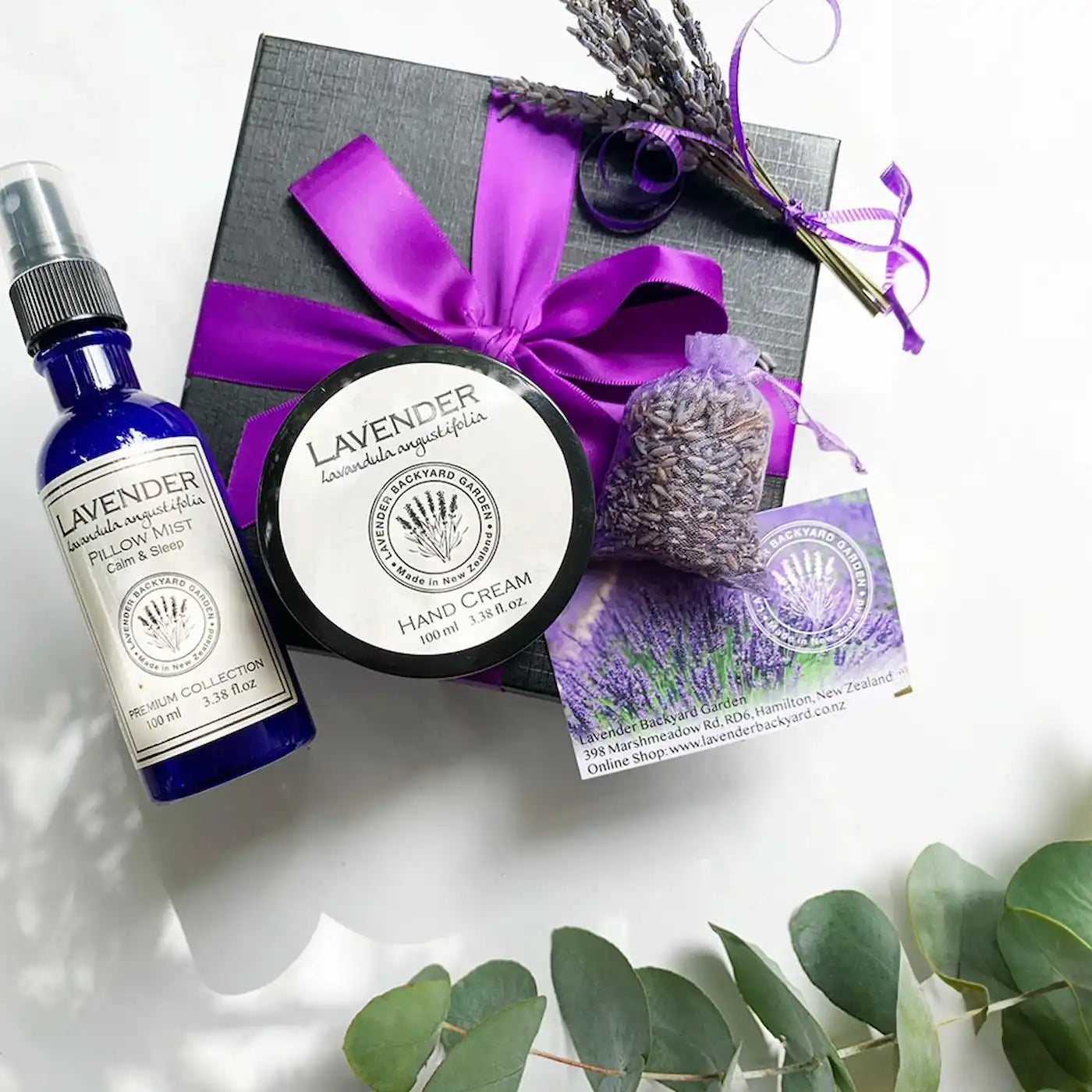 Relax & Sleepwell Lavender Gift Box scented with essential oils, featuring a sleep spray, hand cream, closet sachet, and dried flowers from an NZ lavender farm, presented in a purple ribbon gift box.