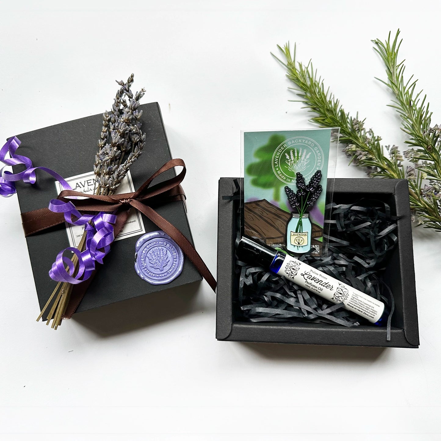 Beautifully Crafted Light Perfume Gift Set featuring lavender light perfume and a jar of lavender fridge magnet, elegantly packaged in a stylish box with a delicate ribbon, accompanied by a mini dried lavender flower.