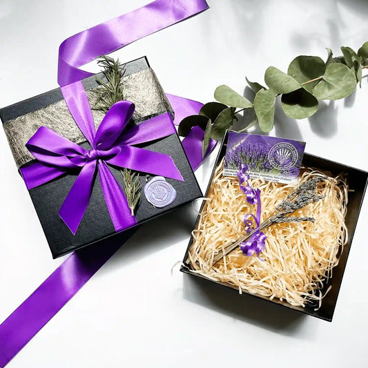 Build your own gift box featuring an empty black gift box with a purple ribbon and mini dried lavender flowers, ready to be personalized with your choice of gifts.