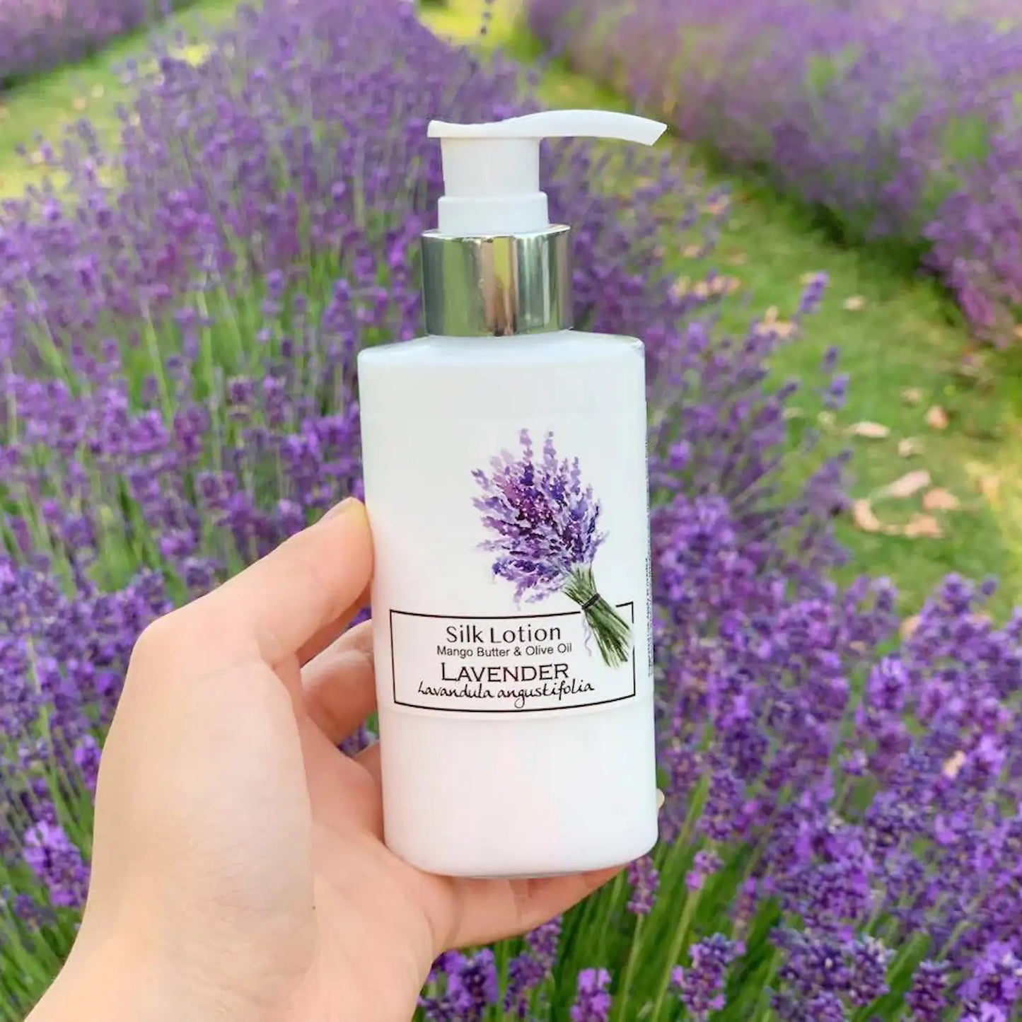 Silky body lotion infused with English lavender (Lavandula angustifolia), set against a serene lavender field background, highlighting its calming and moisturizing properties.