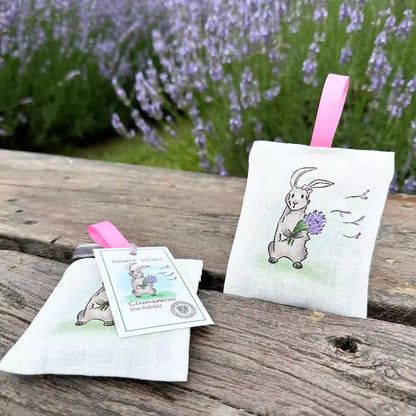 Farm animal rabbit linen drawer sachet scented, placed on a wooden bench with the background of a blooming lavender field at Lavender Backyard Garden, NZ.