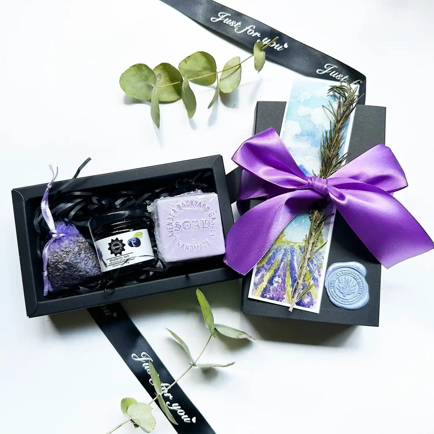 Inexpensive yet Thoughtful Gift Box featuring a lavender sachet, blueberry lavender jam, and lavender-scented handmade soap, beautifully arranged for a delightful gifting experience.