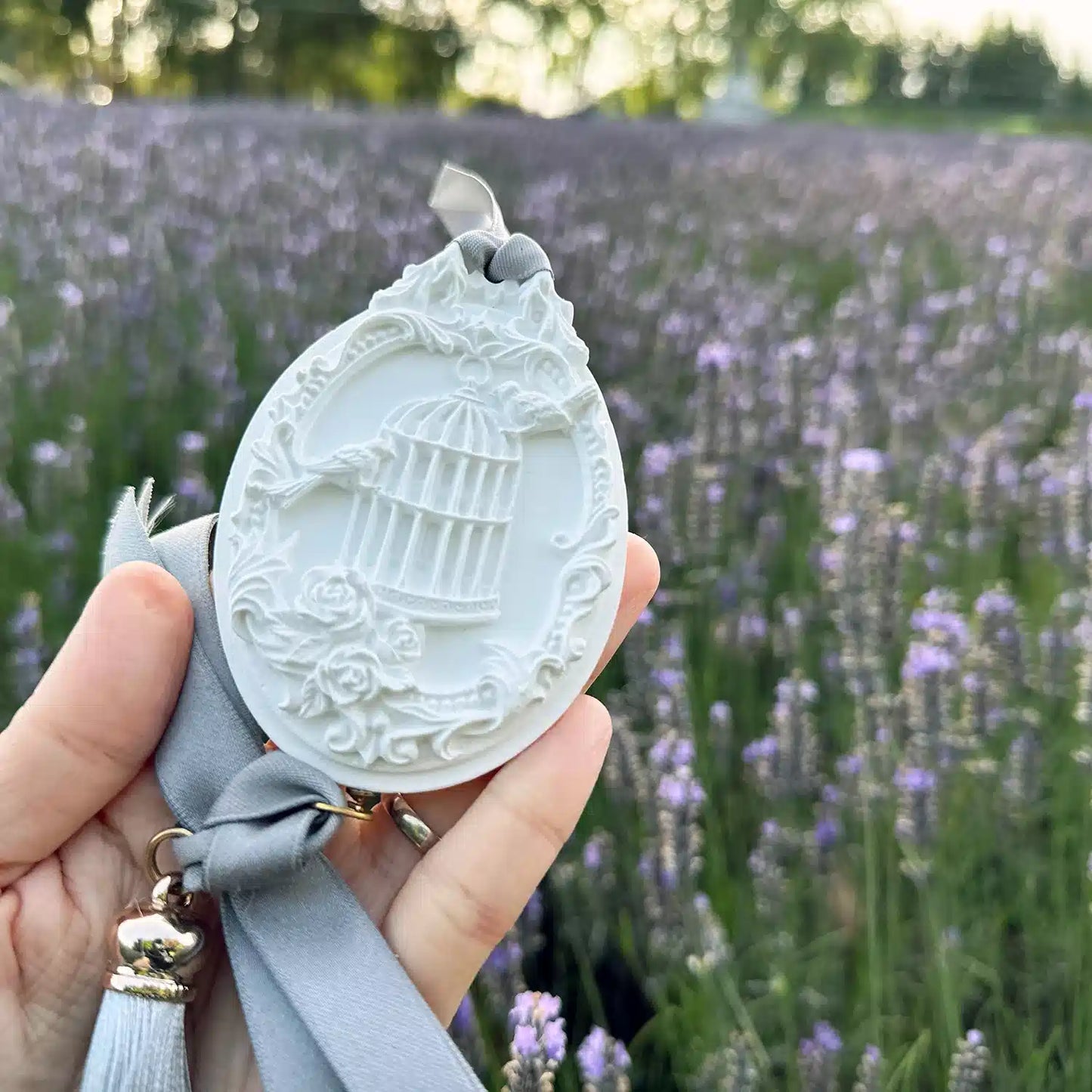 A lavender aroma stone diffuser, designed as an air refresher, set against a purple lavender field at Lavender Backyard Garden in New Zealand.