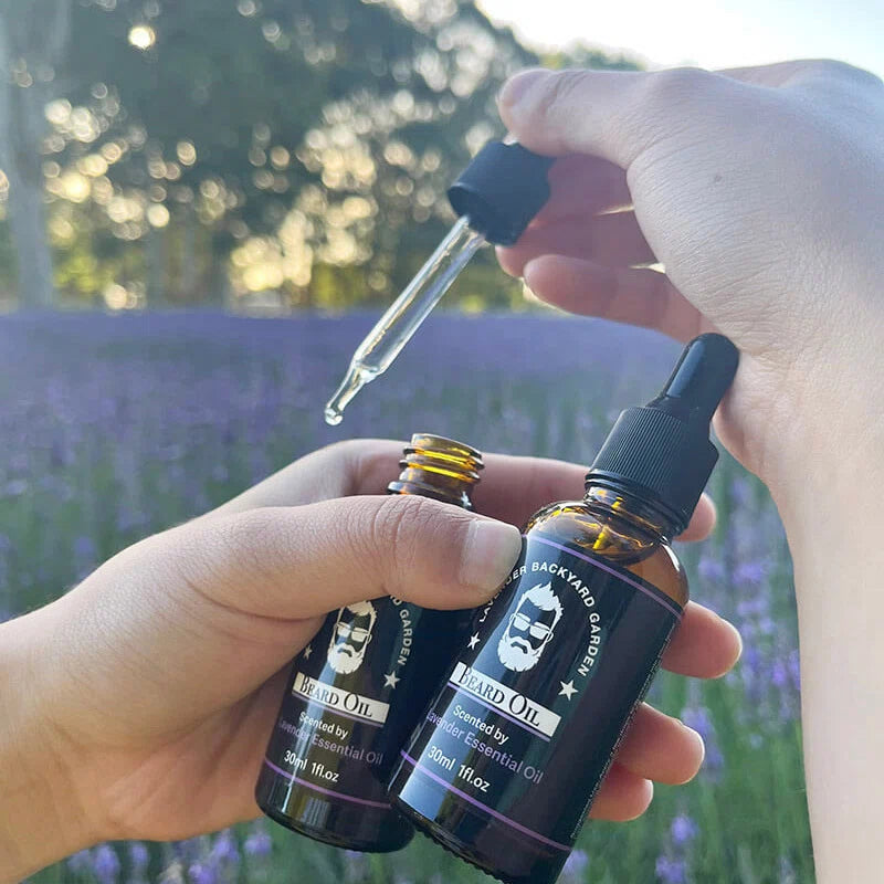 Lavender Beard Oil for Men with a drop of oil on hand, displayed against the background of our lavender field, highlighting its farm-sourced origins.