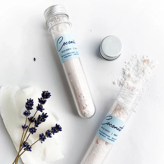 Creamy and relaxing Lavender Coconut Milk Epsom Salt Bath with soothing coconut oil and dried lavender flowers, perfect for a luxurious bath experience.