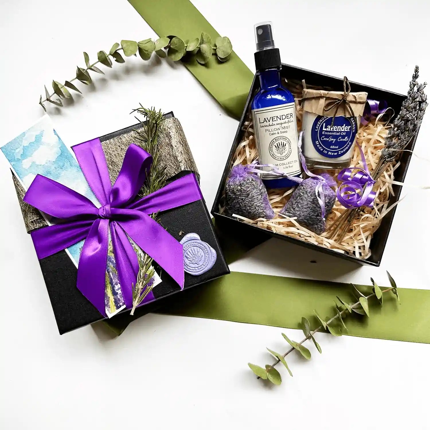 Merry Christmas! Lavender Relaxation Gifts for a Woman" gift box featuring a lavender sleep spray, soy candle scented with lavender essential oil, lavender drawer sachet, all elegantly wrapped with a purple ribbon gift box and a lavender field bookmark.