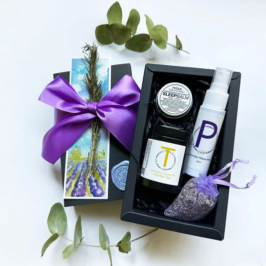 Mindful Teacher Gifts for Relaxation featuring Lavender Sleep Balm Essential Oil Blends, Lavender Sleep Spray (Travel), Lavender & Camomile Herbal Tea (Mini), Dried Lavender Sachet, and Lavender Field Bookmark, all beautifully wrapped in a gift box.