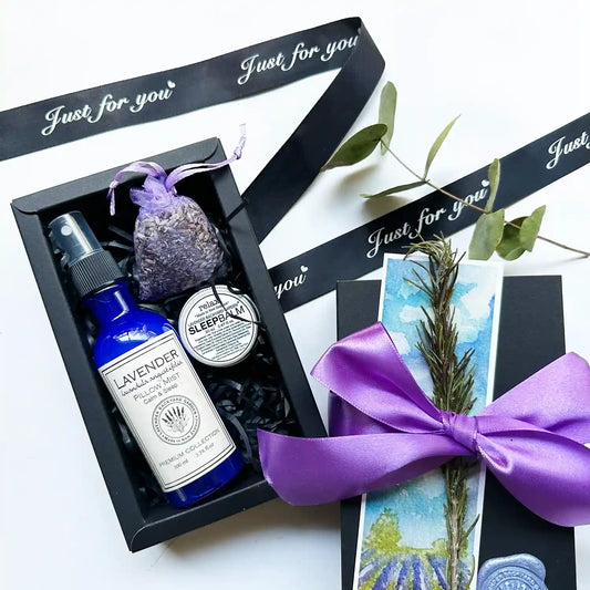 Peaceful Good Night's Sleepwell Gift Box featuring lavender pillow spray, sleep balm scented by essential oils, and a lavender sachet, all beautifully packaged to promote restful sleep and relaxation.