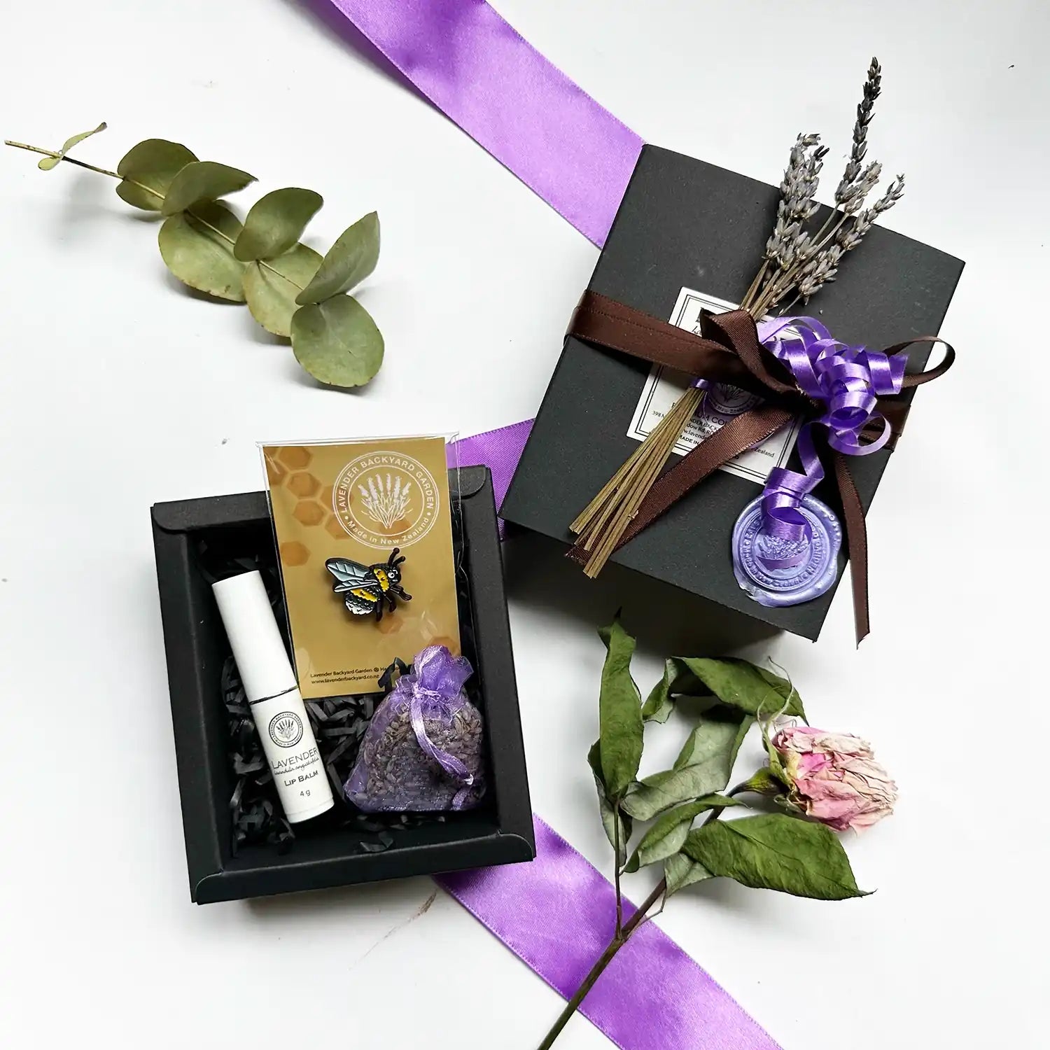 Thank You Present Ideas for Helping Hands gift set featuring Dried Lavender Sachet, Natural Lip Balm for chapped lips, Very Cute Bee Badge, and Mini Dried Lavender Flowers, beautifully wrapped with a brown ribbon.